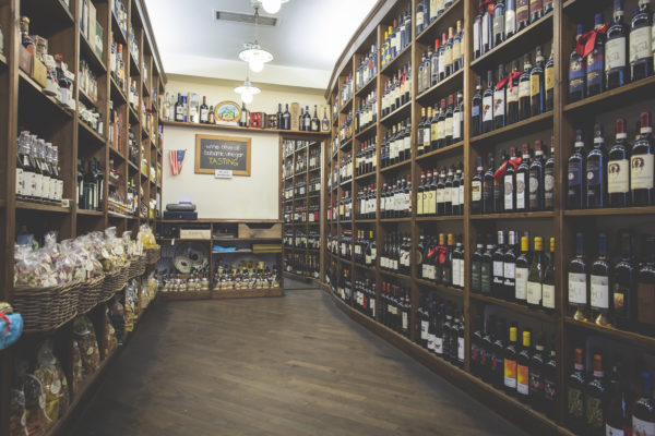 Inside Borgovino, shelves lined with bottles